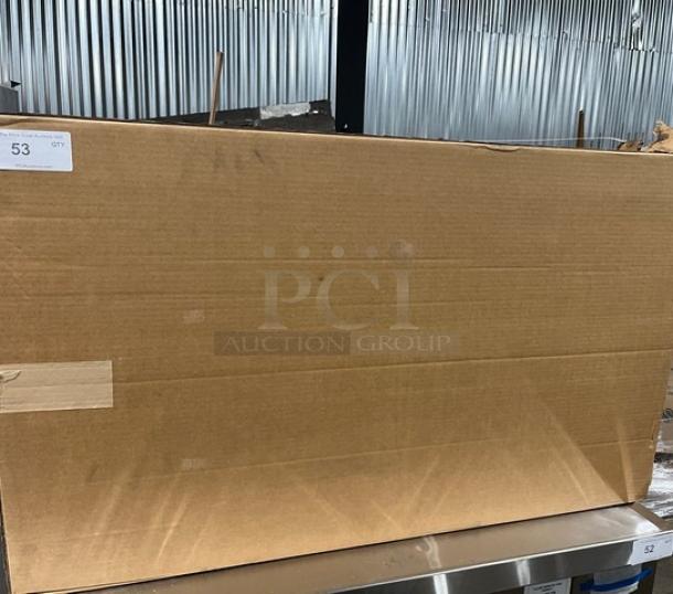 Cardboard box on a metal surface, marked for lot 53, potentially containing a Cres-Cor commercial aluminum pan rack.