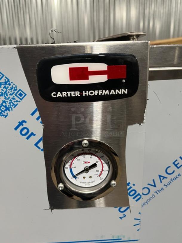 Carter-Hoffmann stainless steel heated cabinet, model BB60-40. Features thermometer and branded label. New condition.