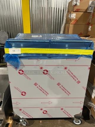 Dinex DXPSBH2P plate heater dispenser, stainless steel, two-silo, 208V, 1 phase, on casters, wrapped in protective film.