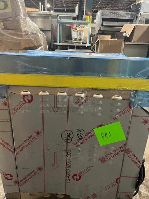 Dinex DXPSBH2P 2-Silo Stainless Steel Plate Heater Dispenser on casters, 208V, 1 Phase. Model and SN visible on packaging.