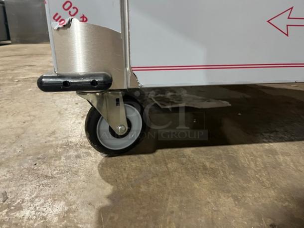 Dinex Model DXPSBH2P stainless steel plate heater dispenser, 2-silo, 208V, 1 phase, on casters, minor wear.