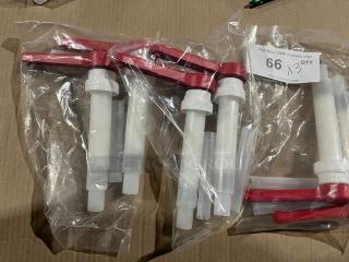 Brand new commercial condiment dispenser pumps with red tops, packaged in clear plastic.