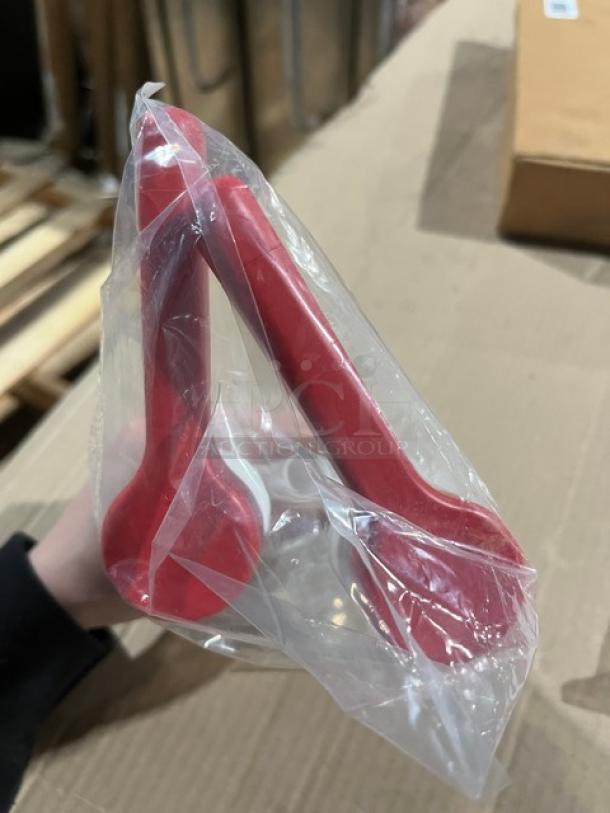 Brand new commercial condiment dispenser pump with red top, sealed in clear packaging, ideal for restaurants or cafes.