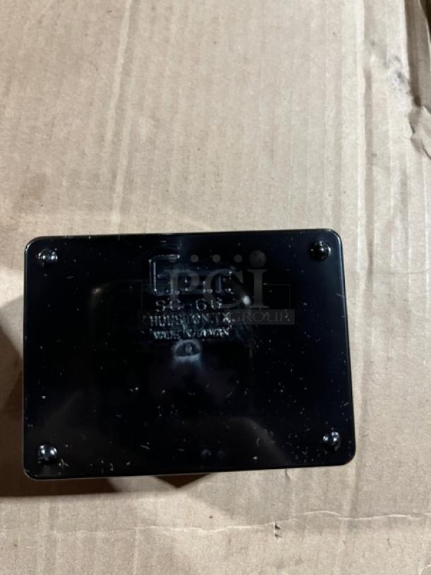 Brand new commercial black condiment caddie, model SC-66, with visible manufacturer markings.