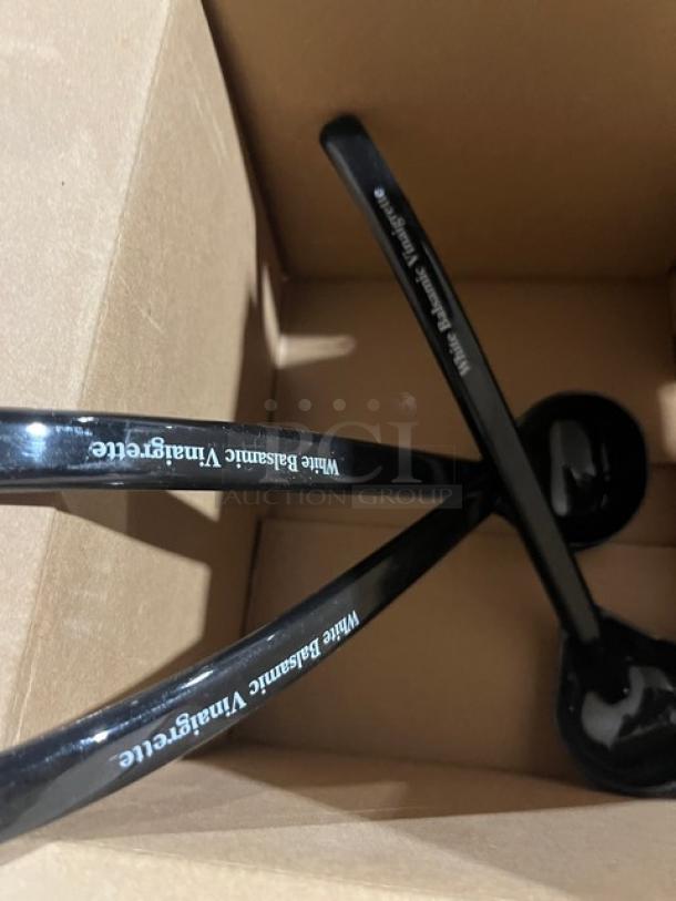 Carlisle NSF2 black ladles, 9.5", new condition, labeled "White Balsamic Vinaigrette," set in a cardboard box.