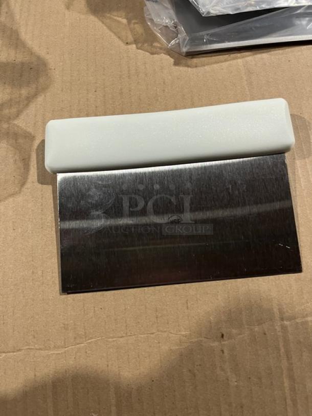 Brand new Jimmy John's style stainless steel dough scraper/cutter with white grip handle, unused condition.