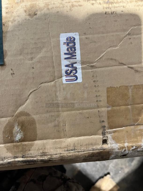 Rocky Mountain Cookware 4-burner broiler, model MB248. New in box. USA made sticker visible; features grease tray.