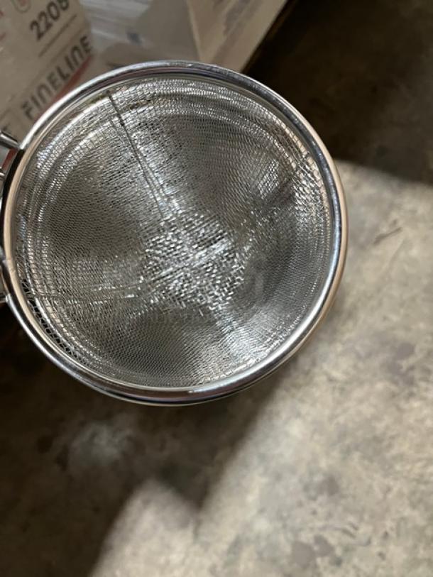 Brand new Thunder Group 5-1/2" stainless steel noodle skimmer, Model SLNS001, with black wooden handle.