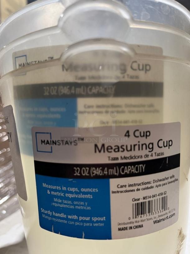 Mainstays Commercial 32 Oz Clear Measuring Cup, dishwasher safe, featuring measurements in cups, ounces, and metrics, with a sturdy handle.