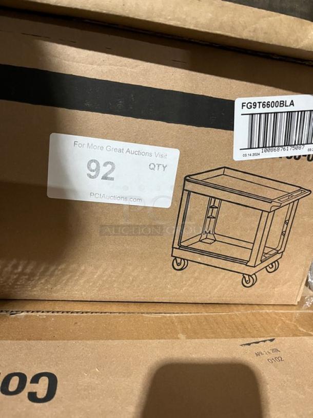 Rubbermaid Commercial 2-Shelf Utility Cart, Model 9T6600, new in box. Features include casters and durable construction.