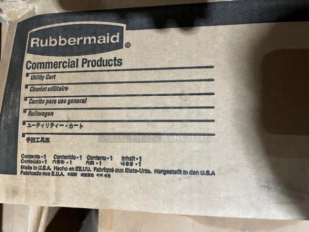 Rubbermaid Commercial 2-Shelf Utility Cart, Model 9T6600, in packaging. Features include casters for mobility. Made in USA.