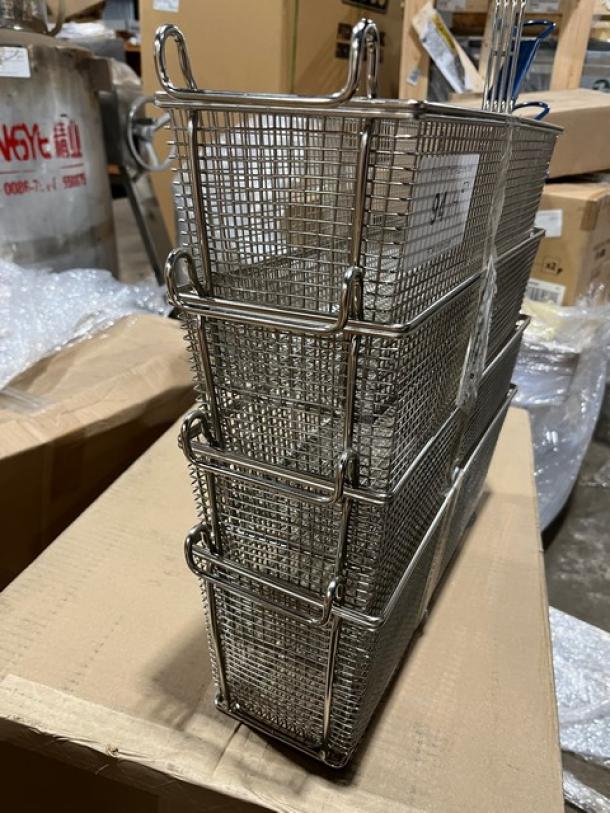 Brand new commercial stainless steel deep fry basket with front hook and non-slip grip handle, stacked on cardboard.