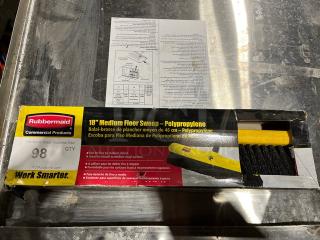Rubbermaid Commercial 18" Medium Broom Head with polypropylene bristles in original packaging, ideal for medium surfaces.