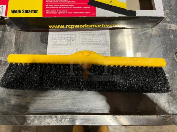 Rubbermaid Commercial 18" medium broom head with yellow base and black polypropylene bristles. New condition.