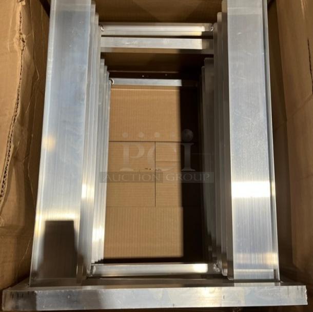 Brand new Channel custom-made bun rack, aluminum construction, shown unassembled in original packaging.