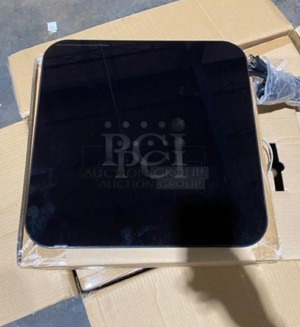 Brand new Spring USA SM300CR black induction warmer, 120V, on cardboard box; high-quality countertop single burner.