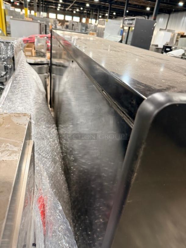 Brand new Southern Case Arts refrigerated merchandiser, Model MDC53LVN-090, on pallet, wrapped in protective material.