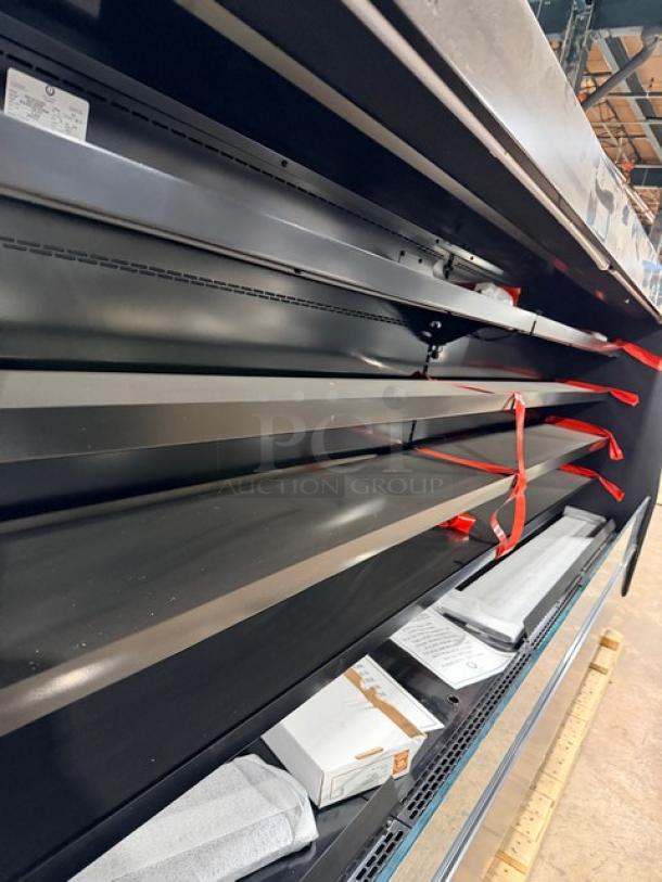 Brand new Southern Case Arts MDC53LVN-090 refrigerated merchandiser on pallet. Multi-tier shelves, remote compressor, model and serial tags visible.