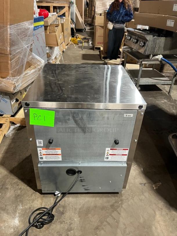 True TUC-27D-2-HC stainless steel 2-drawer refrigerated lowboy cooler, brand new, on casters, with power cord and safety labels.