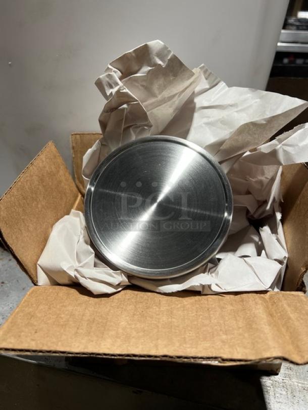 Cardboard box containing a Brand New Cal-Mil commercial 16oz stainless steel mixology jar lid, Model 1851-4, wrapped in paper.