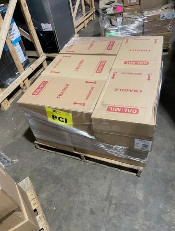 Brand new full pallet of Cambro 16CW white commercial food storage pans, boxes labeled "Fragile," on warehouse floor.