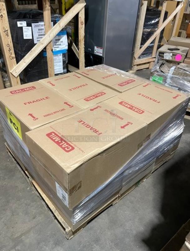 Full pallet of brand new Cambro 16CW commercial white food storage pans in boxes marked 'Fragile' and 'This Side Up.'