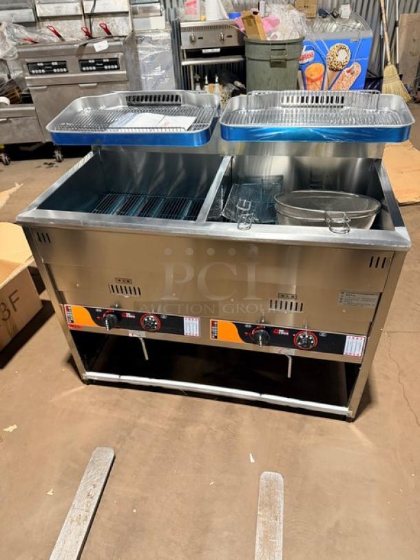 Brand new Goreous stainless steel dual bay electric deep fat fryer with cabinet base. Features control dials and leg supports.
