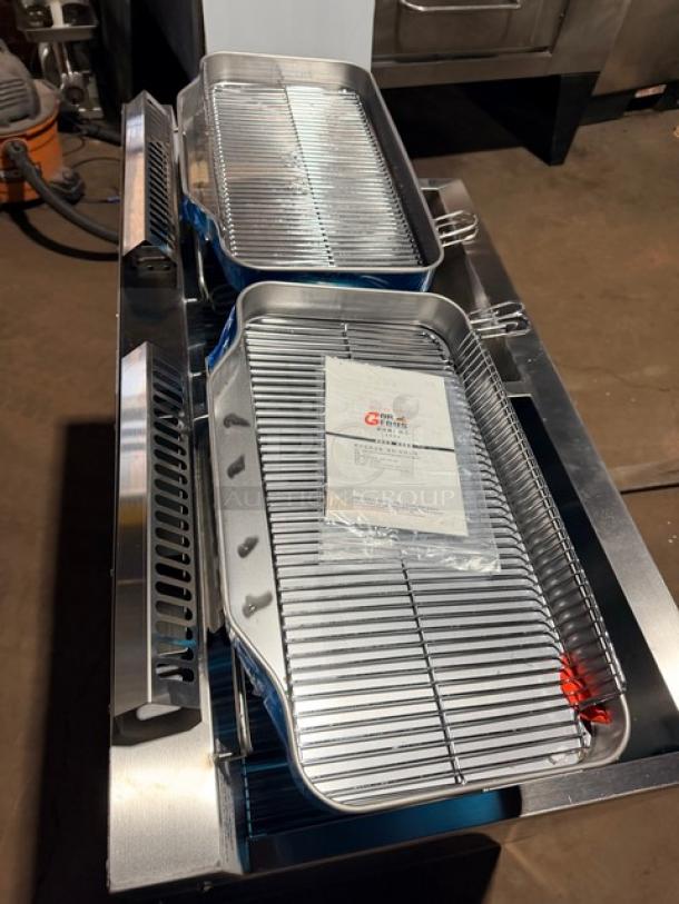 Brand new Goreous dual bay electric deep fat fryer, all stainless steel, cabinet base style, on legs, includes racks.