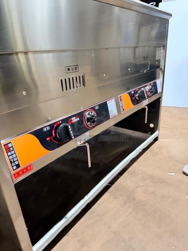 Brand new Goreous stainless steel dual bay electric deep fat fryer, cabinet base style on legs, controls visible.
