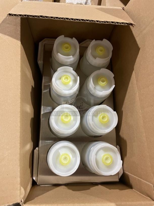 Box containing multiple sealed plastic bottles with yellow caps, stacked in a cardboard carton.