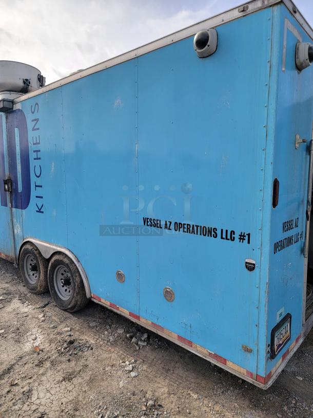 Blue mobile kitchen trailer, labeled "Vessel AZ Operations LLC #1." Visible wear on tires and exterior. Equipped with security cameras.