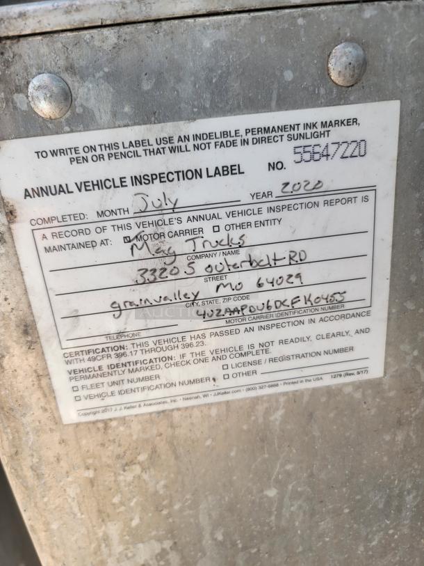 Annual vehicle inspection label from July 2020 by Meg Trucks, Grain Valley, MO. Label number 55647220.