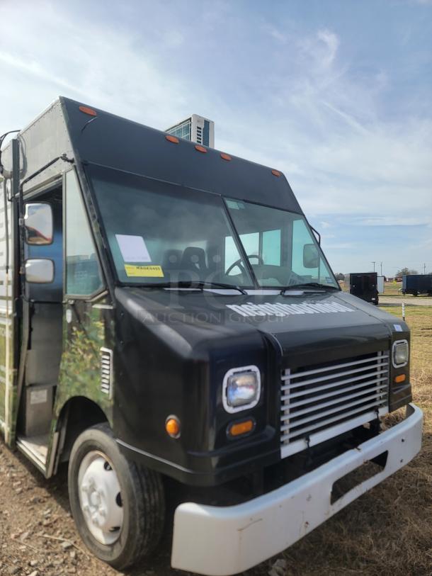 Black food truck with white bumper and side mirrors, displaying "neighborhood" on the front. In good condition, no visible damage.