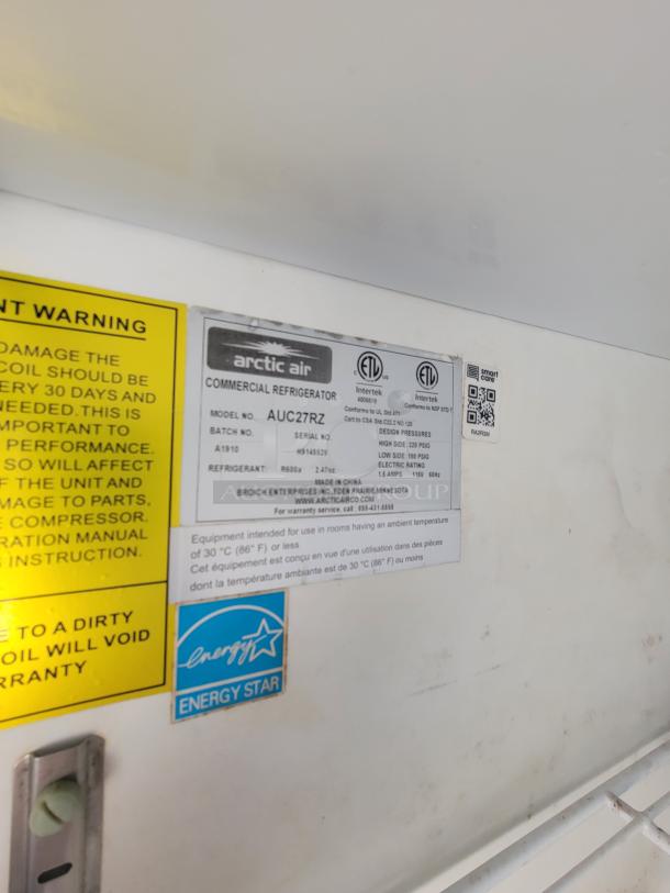Arctic Air commercial refrigerator model AUC27R, Energy Star rated, warning label and specifications visible.