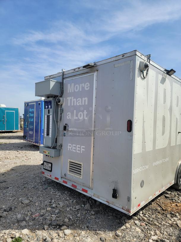 Mobile food unit by REEF, marked "More Than a Lot." Features include exterior electrical panel, rear vents, and storage. Good condition.