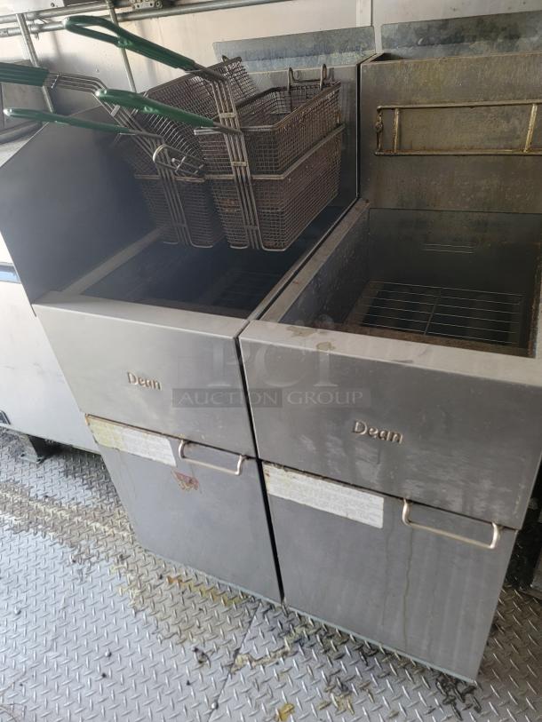 Commercial double deep fryer by Dean with baskets, stainless steel construction, used condition, visible wear on surface.