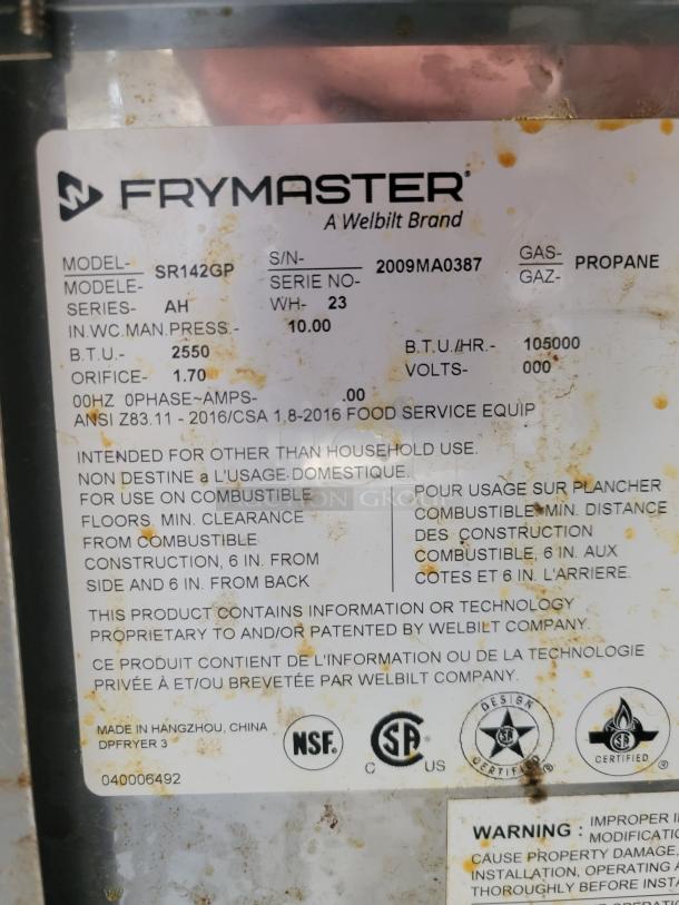 Frymaster gas fryer label, model SR142GP, uses propane, 105,000 BTU/hr. Markings indicate ANSI standards and NSF certification.