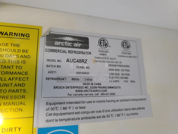 Arctic Air commercial refrigerator label showing model AUC48RZ, refrigerant R600a, 115V, 3.0 amps. Made in China.