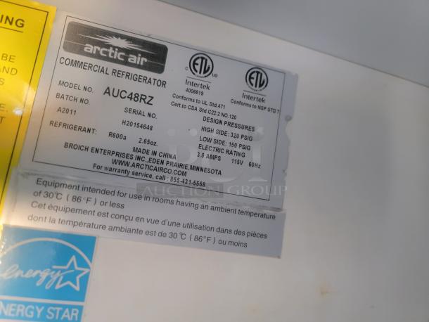 Arctic Air commercial refrigerator AUC48RZ label showing model, batch, and serial numbers. Energy-efficient R600a refrigerant.