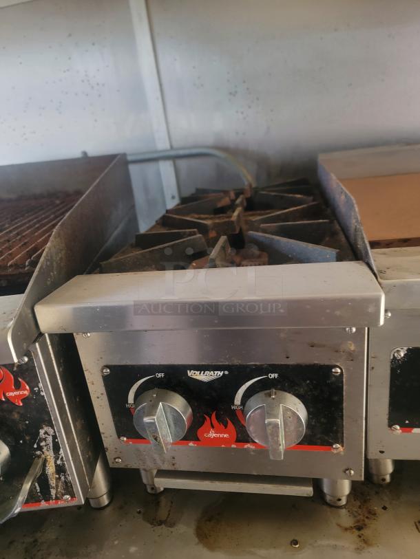 Vollrath Cayenne commercial gas burner with dual controls, used condition, visible wear and residue on surface.