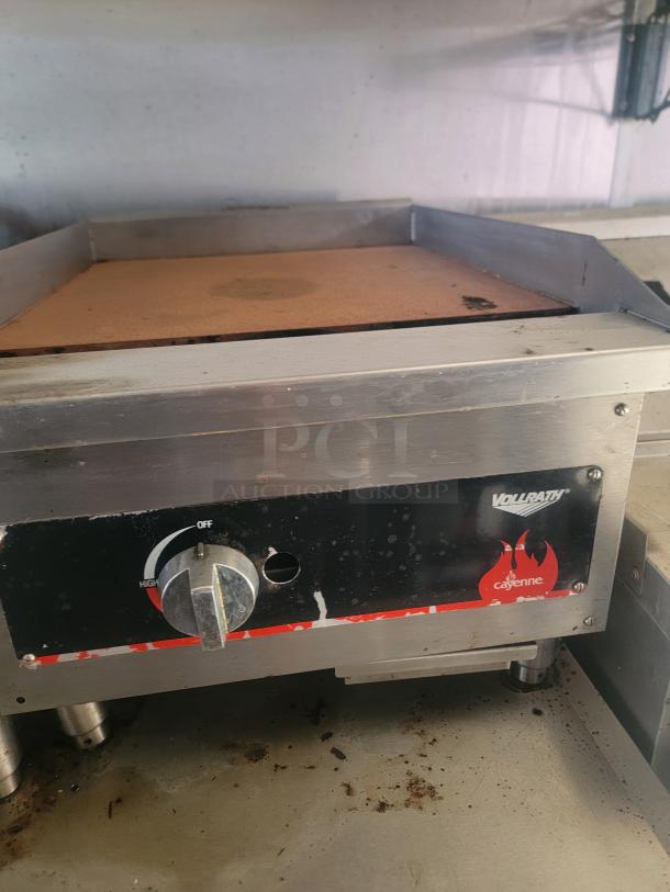 Vollrath Cayenne electric countertop griddle with temperature dial, stainless steel body, and signs of wear.