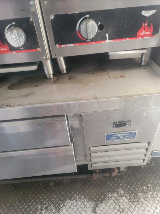 Commercial kitchen equipment including Arctic Air refrigerator and Vollrath Cayenne burners, stainless steel, used condition.
