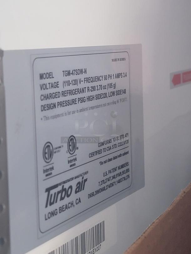 Turbo Air model TGM-47SDW-N label, voltage 110-120V, refrigerant R-290, design pressure PSIG high side 320, low side 148. Made in Korea.