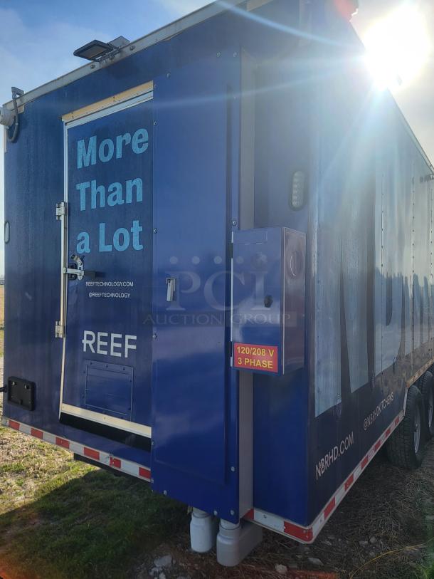Blue mobile unit with "REEF" branding and "120/208 V 3 Phase" label, indicating electrical specifications.