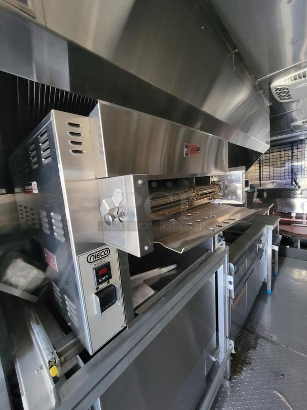 Nieco commercial conveyor broiler, stainless steel, excellent condition, model label visible, ideal for high-volume kitchens.