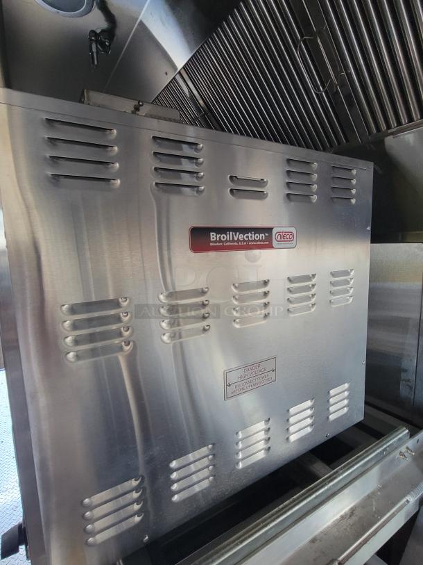 Nieco BroilVection commercial broiler, stainless steel, vented design. Labels indicate high voltage warning. Appears in good condition.