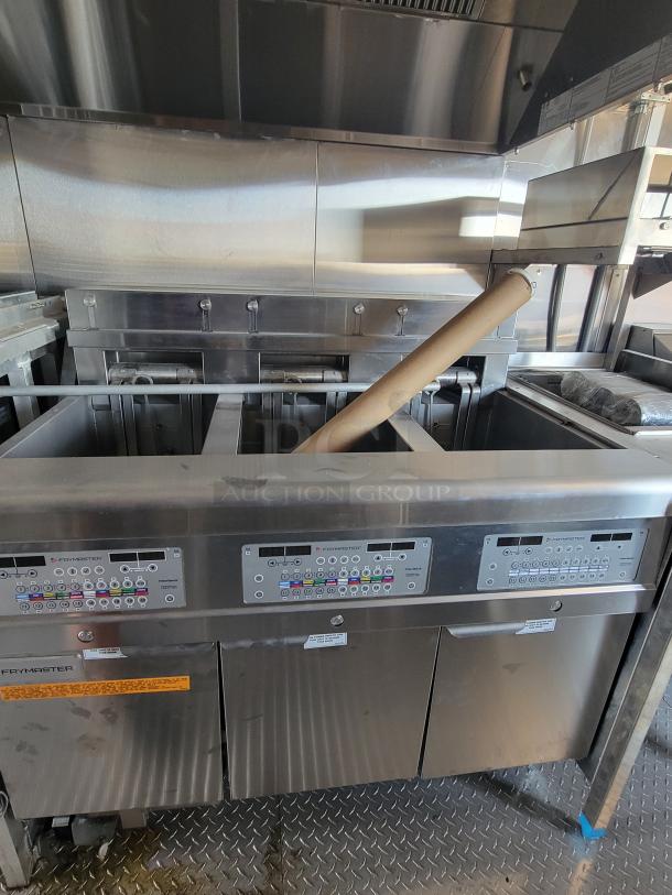 Frymaster commercial deep fryer with digital controls, multiple fry baskets, and stainless steel finish. Excellent condition.