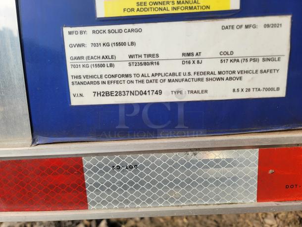 Rock Solid Cargo trailer label showing specifications: GVWR 7031 kg, GAWR 7031 kg, manufactured 09/2021, V.I.N. 7H2BE2837ND041749.