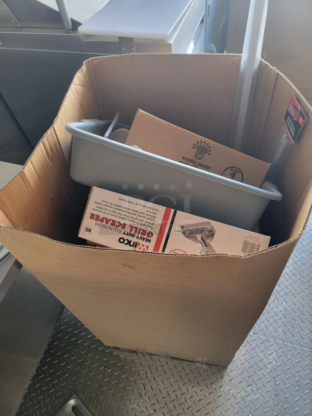 Cardboard box containing a Kitchen Brains appliance box and a Nemco grill scraper box. Items appear new.