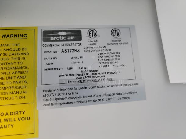 Arctic Air Commercial Refrigerator, Model AST72RZ. Label shows serial H20093412, refrigerant R290, 115V, 4.3A. Made in China.